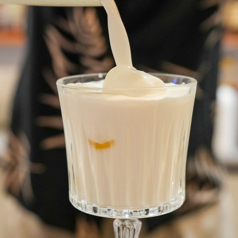 Thick milkshake being poured at Starlight Beach Bar