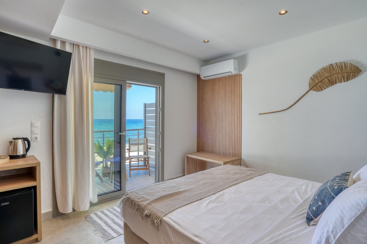 Sea View Room Deluxe at Starlight Ocean View with a double bed and balcony facing the Aegean
